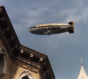 Aren't you sick of blimps?  There's the Goodyear Blimp, the Fuji Blimp, the Met Life Blimp, even an Alta Vista (the search engine) blimp.  Give me a break.  Or bring back the Hindenburg.