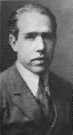 Niels Bohr, who never appeared on The Arsenio Hall Show, seen here in a tiny photograph.