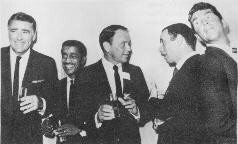 Folk music fans do not appreciate the boozy badinage of Messrs. Sinatra, Lawford, Martin, Bishop, and Davis, Jr.