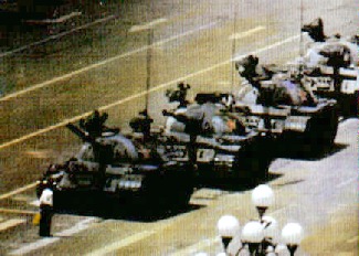 Man trying to sell oranges to soldiers.